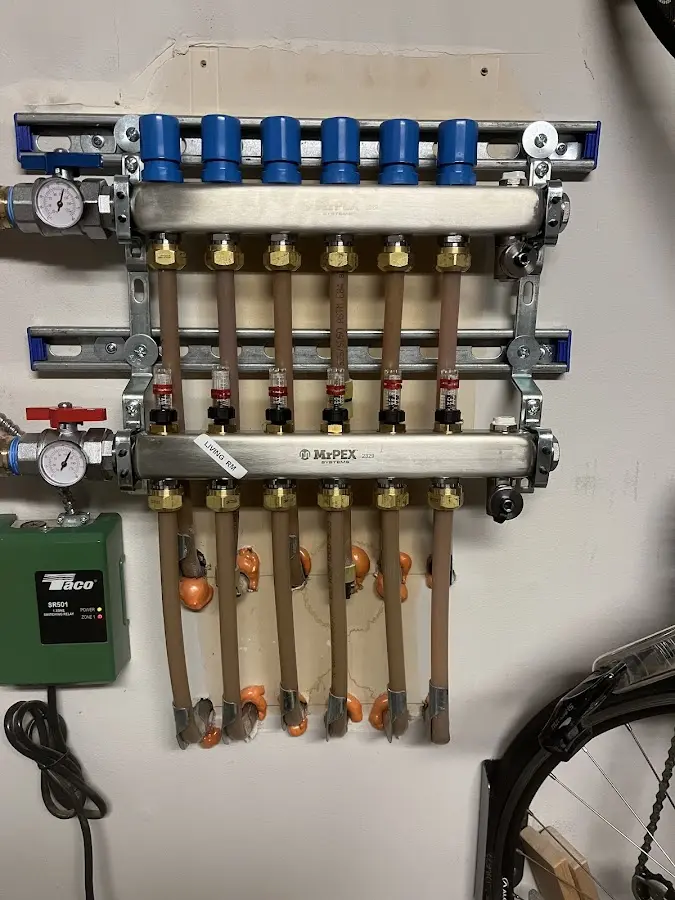 Plumber performing Water Heater Repair at a residential property in Webster